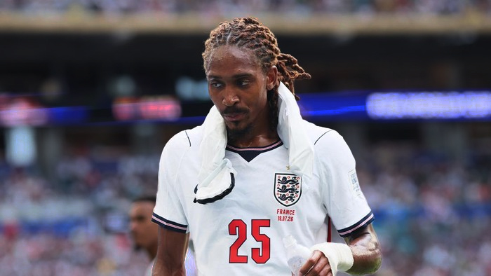 England national team footballer wearing jersey number 25 on the pitch, with a towel draped over his shoulders